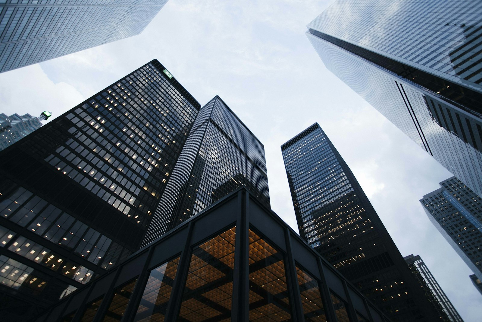 Low-angle view of office towers, representing a team serving international markets